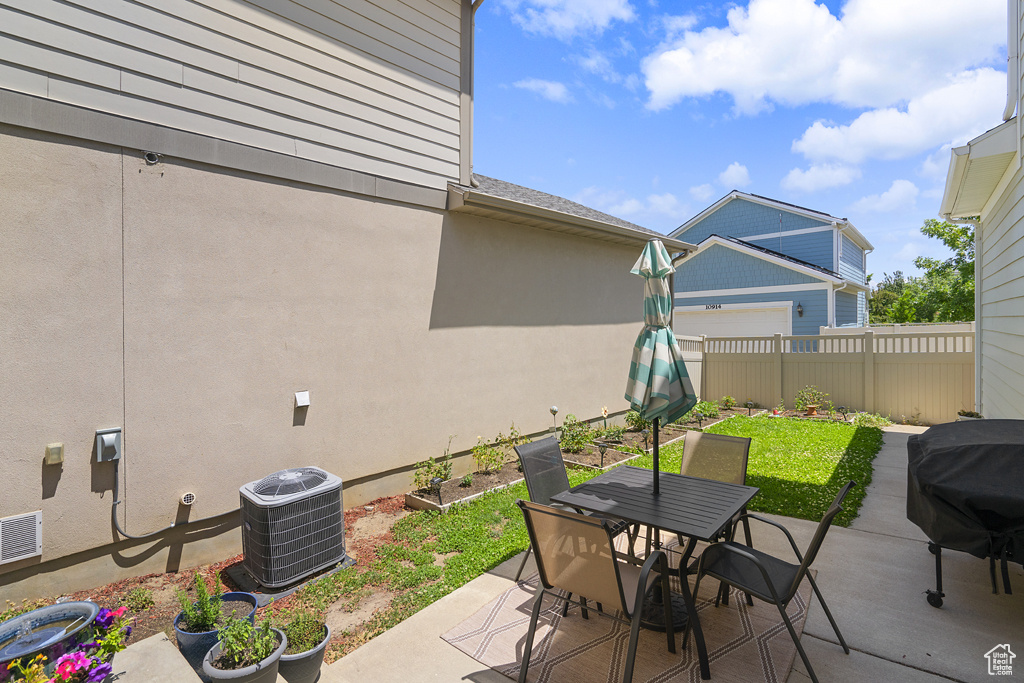 View of patio / terrace featuring grilling area and outdoor dining area