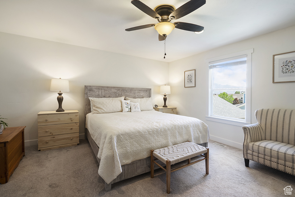 Bedroom with carpet and a ceiling fan