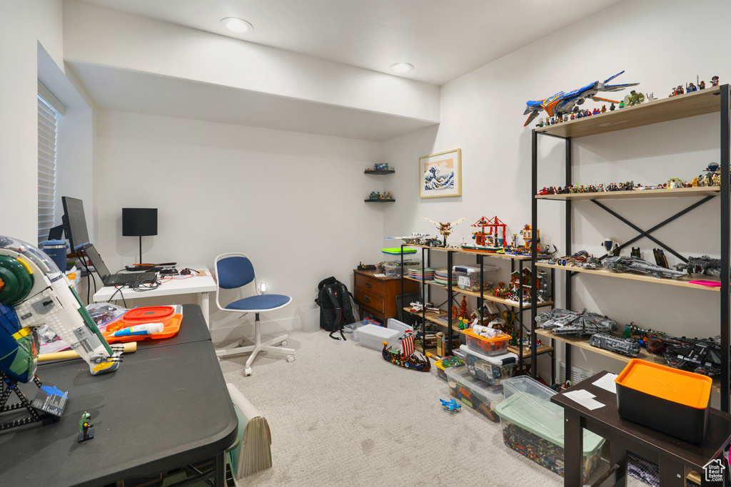 Carpeted home office featuring recessed lighting