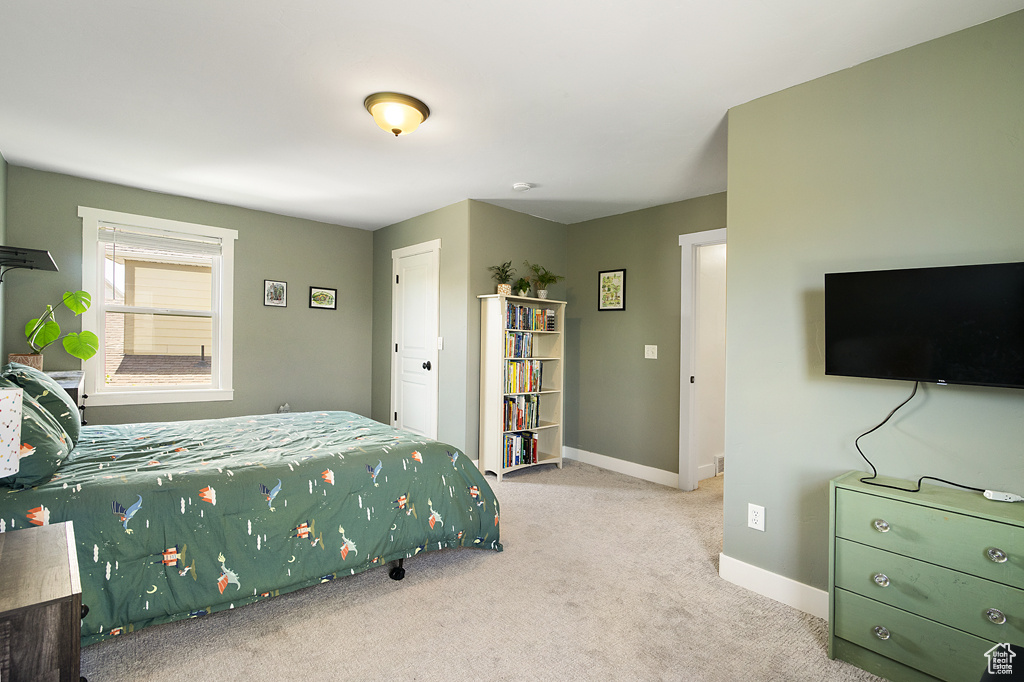 Bedroom with carpet and baseboards