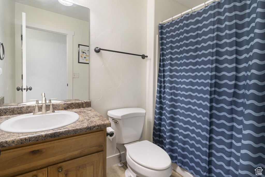 Full bathroom featuring vanity and a shower with shower curtain