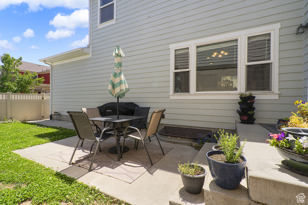 View of patio with outdoor dining area