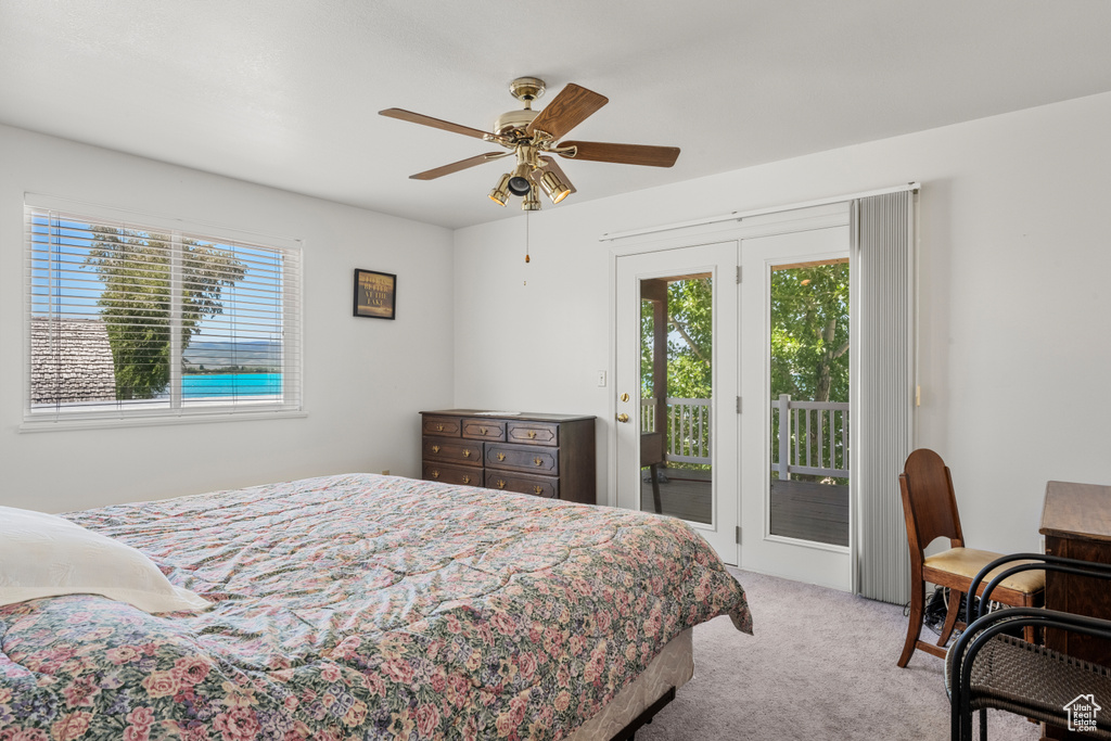 Bedroom featuring carpet, access to outside, and ceiling fan