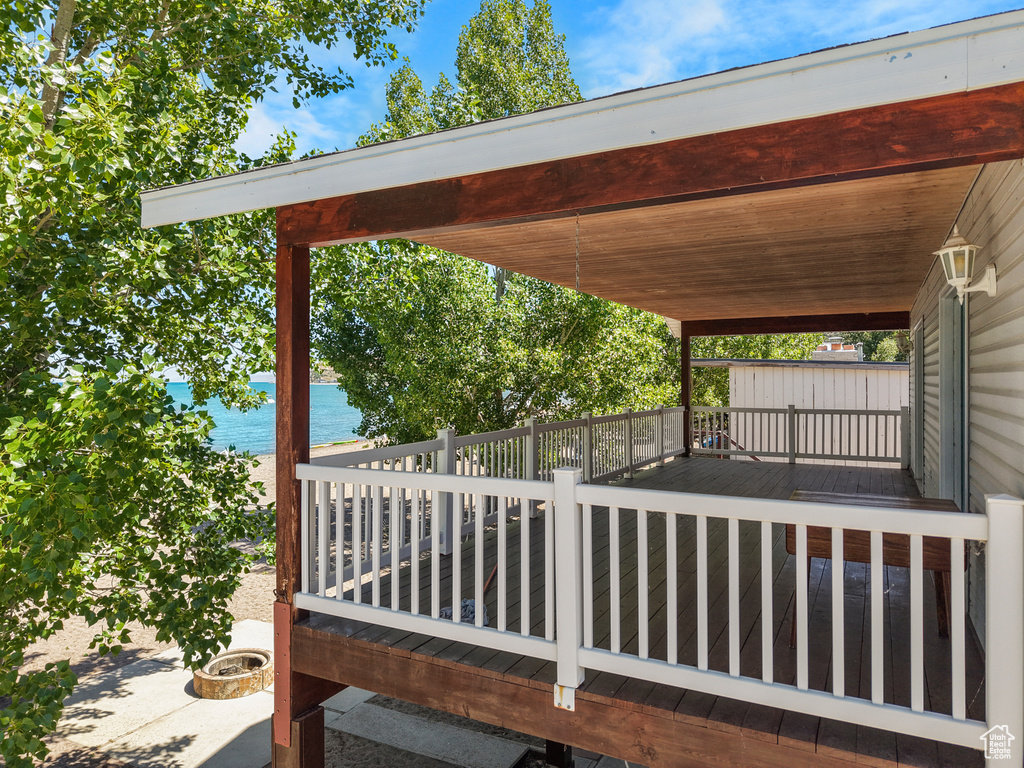 Wooden terrace featuring a water view