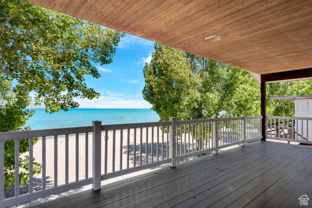 Wooden deck featuring a water view