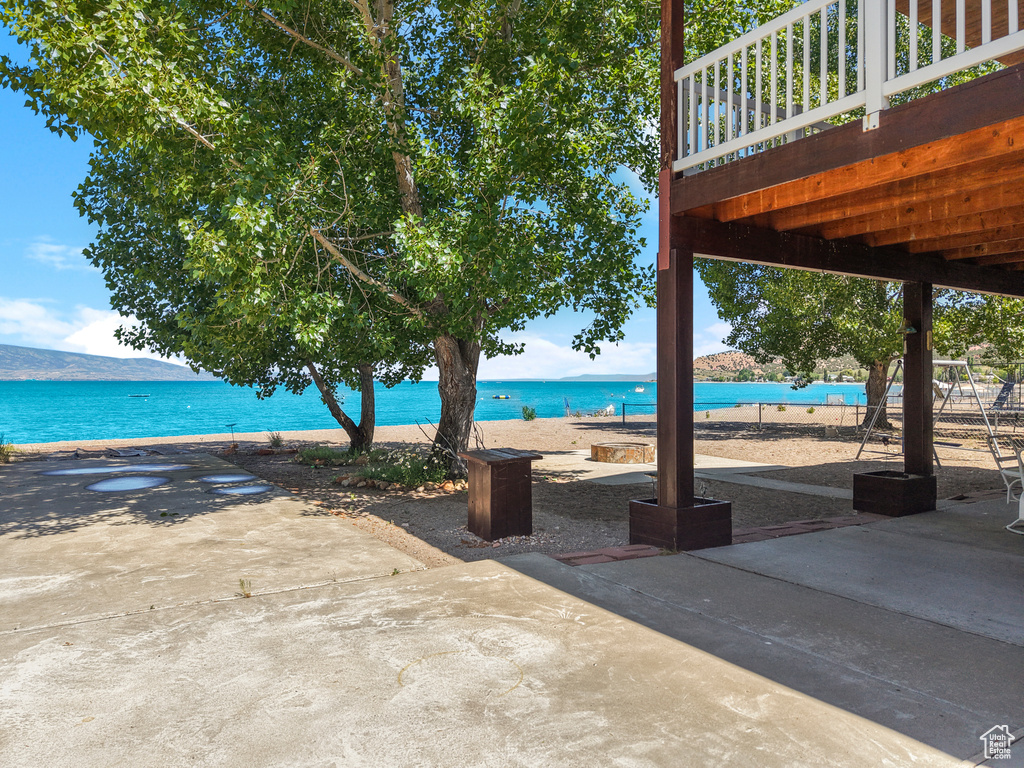 View of patio with view of water and beach