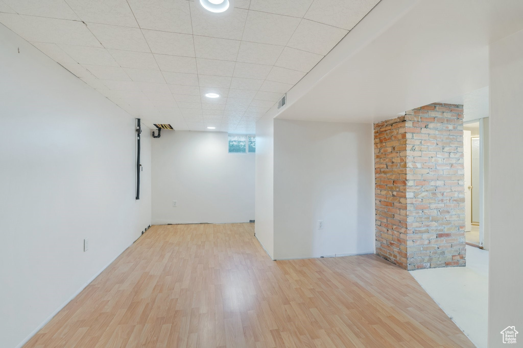 Spare room with wood finished floors, recessed lighting, and a paneled ceiling