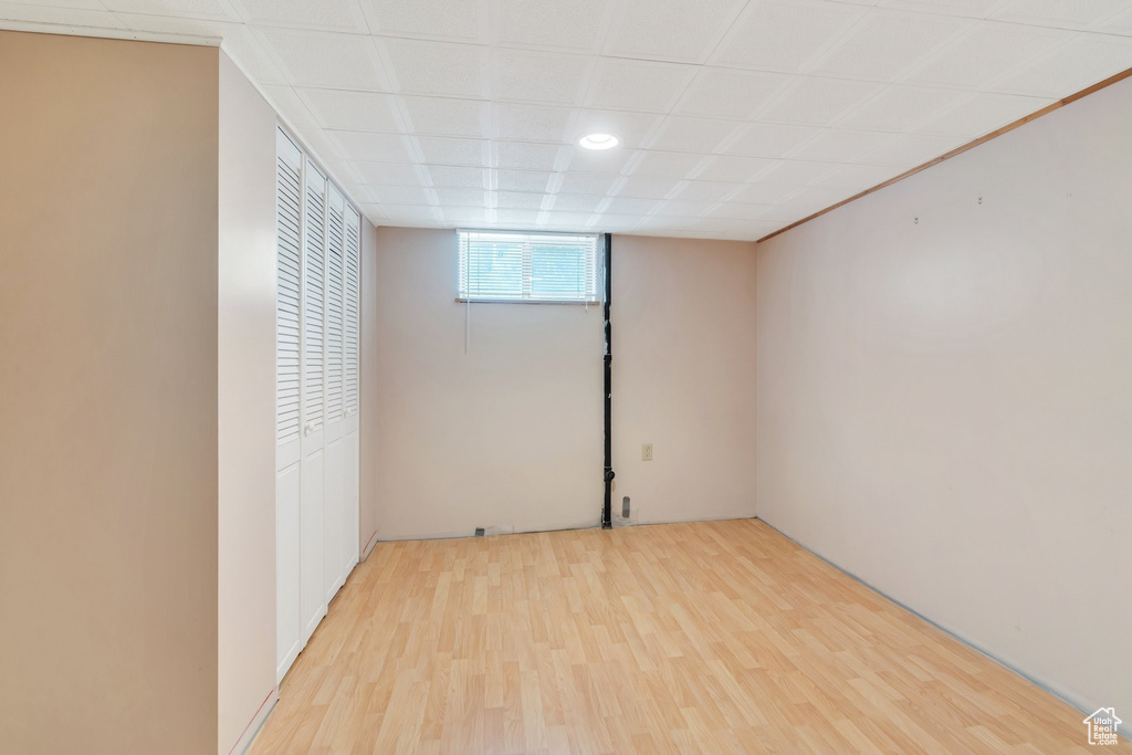 Below grade area with light wood-type flooring