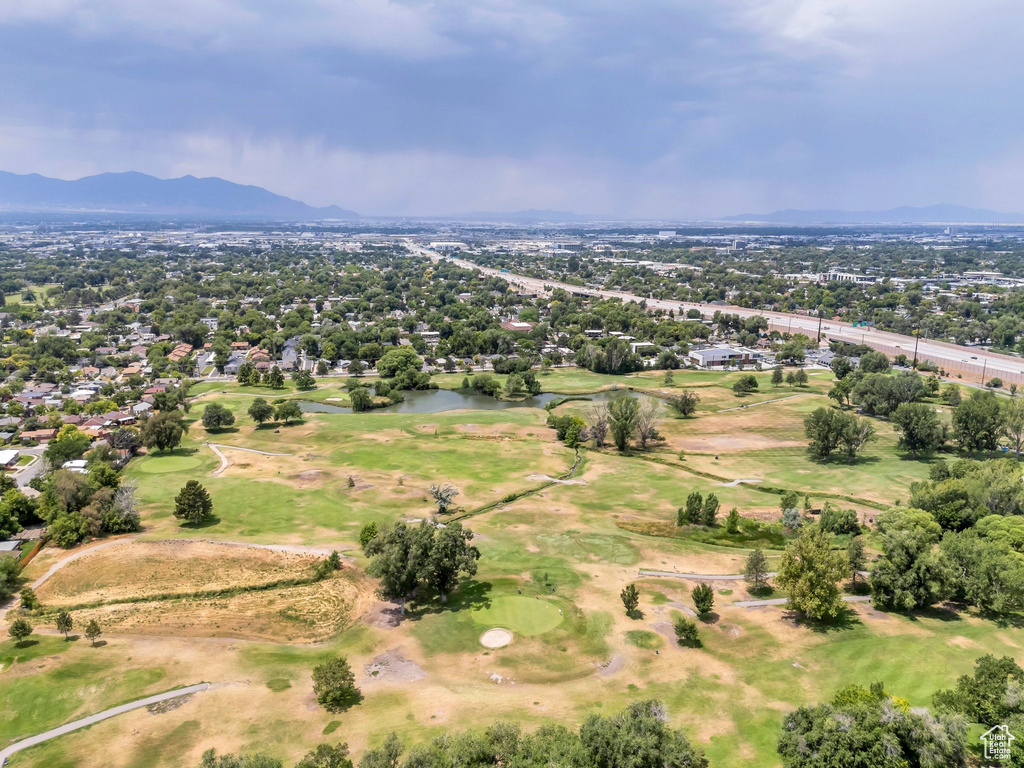 Aerial view of a mountain backdrop and a golf club