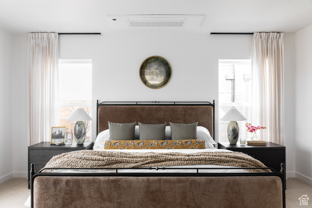 Bedroom with carpet floors and baseboards