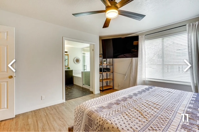 Bedroom featuring wood finished floors, ensuite bath, and a ceiling fan