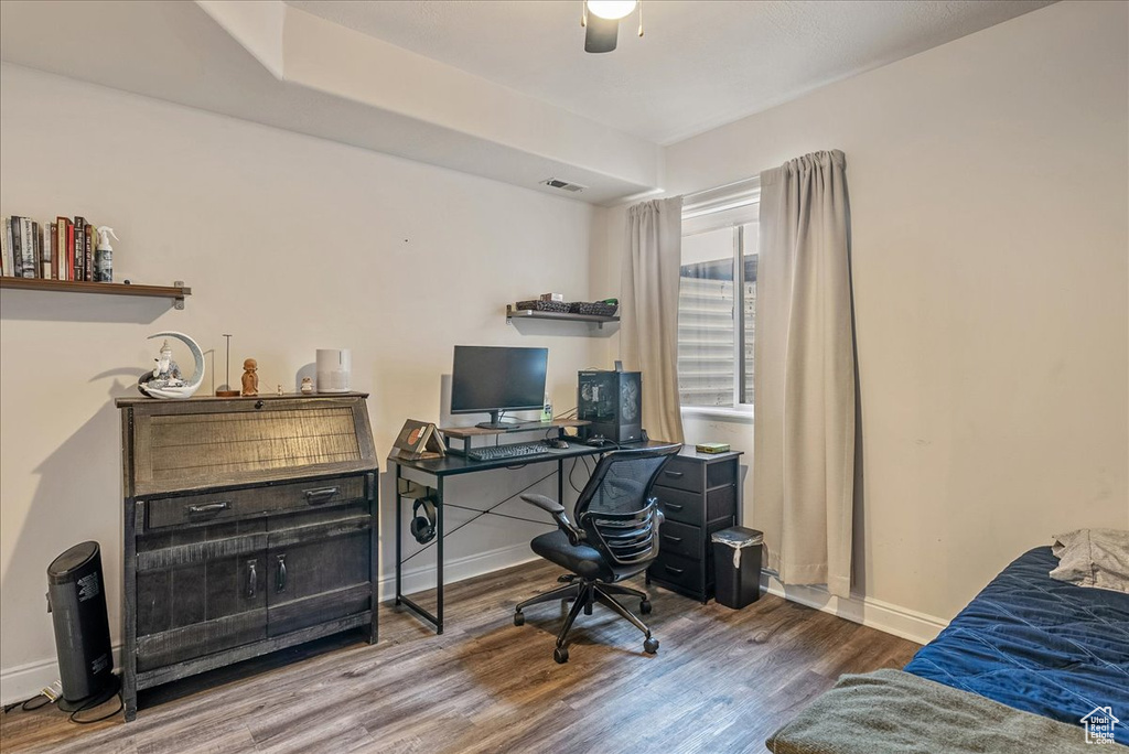 Office space featuring wood finished floors and a ceiling fan
