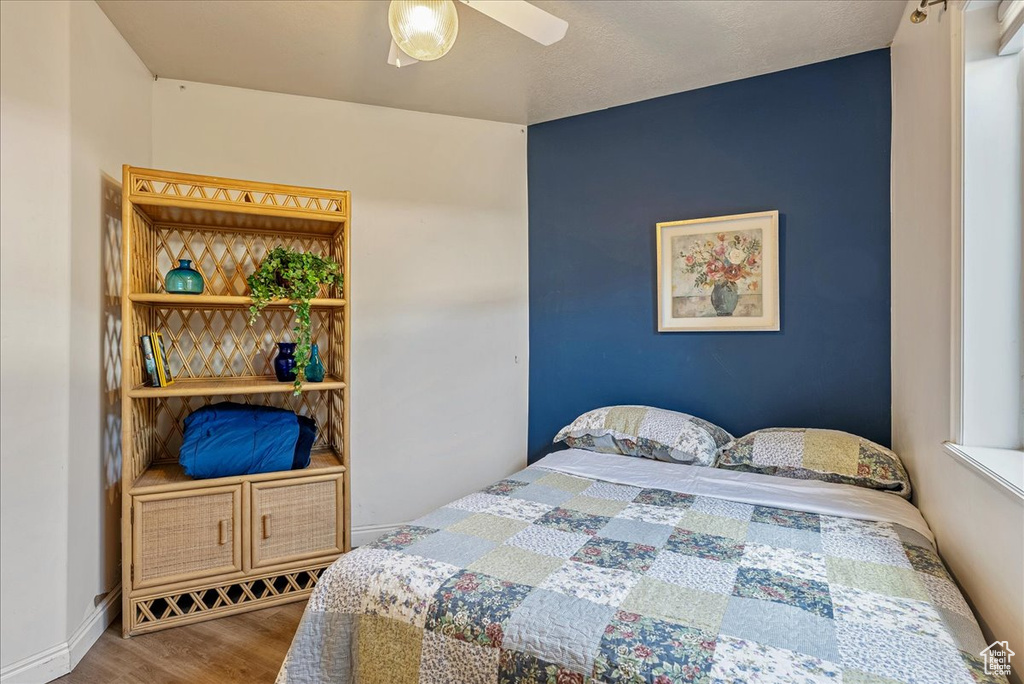 Bedroom with wood finished floors