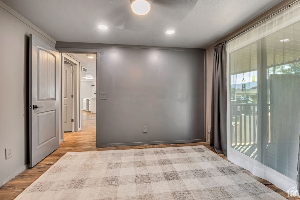 Unfurnished room featuring light wood-type flooring and recessed lighting