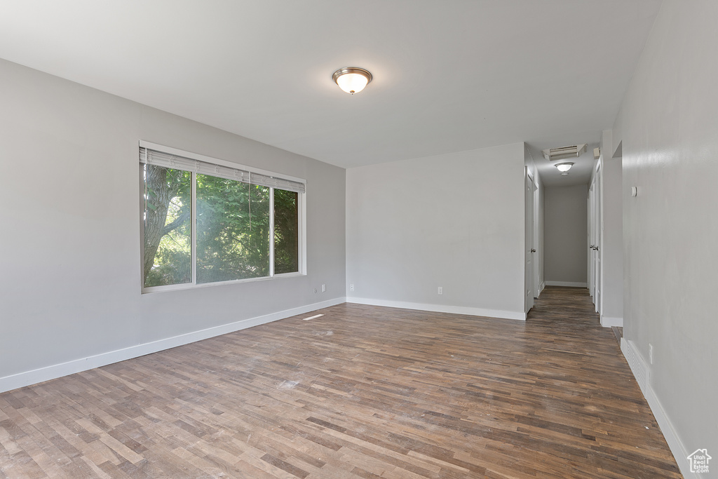 Spare room with wood finished floors