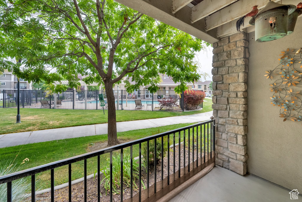 Balcony with view of pool area