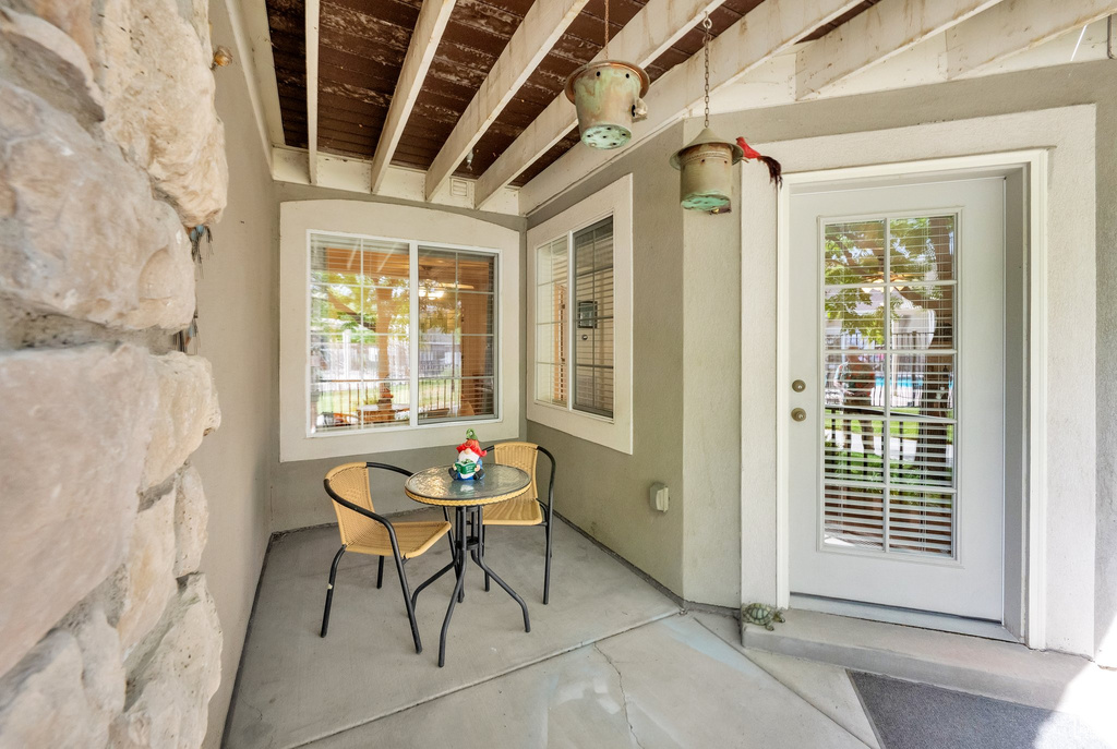Entrance to property with stucco siding