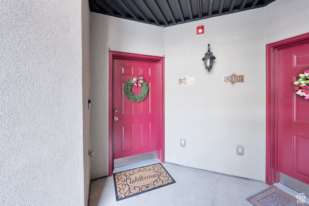 Property entrance with stucco siding