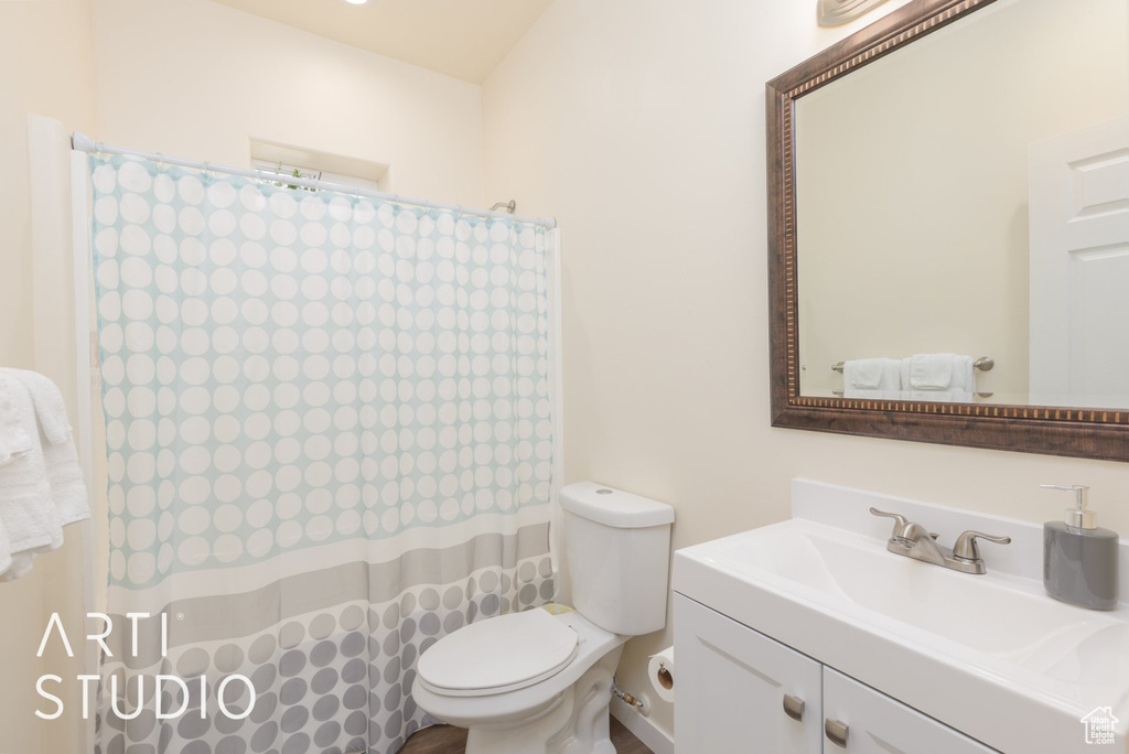 Bathroom featuring vanity and a shower with curtain