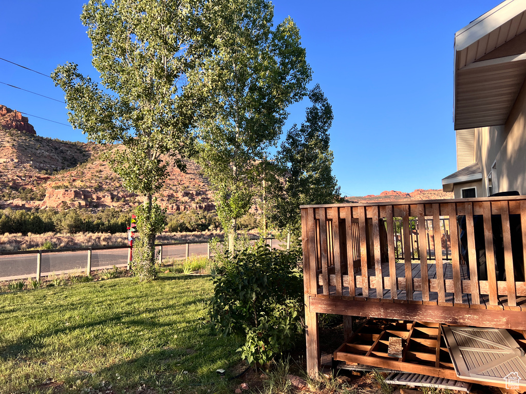 View of yard featuring a wooden deck
