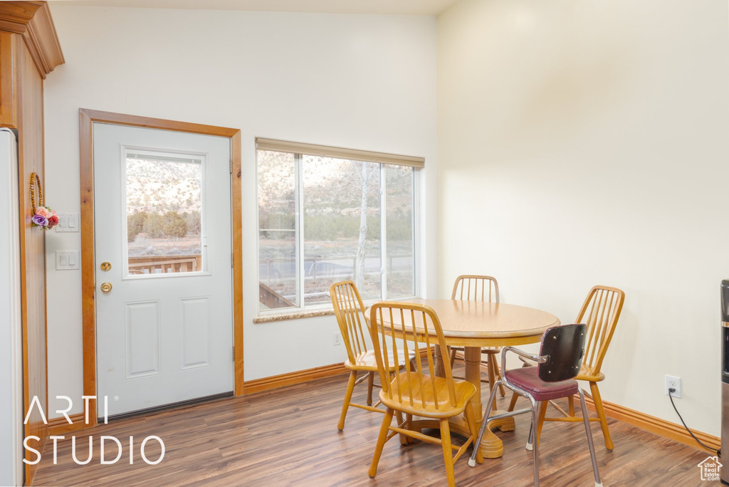 Dining room featuring wood finished floors and plenty of natural light