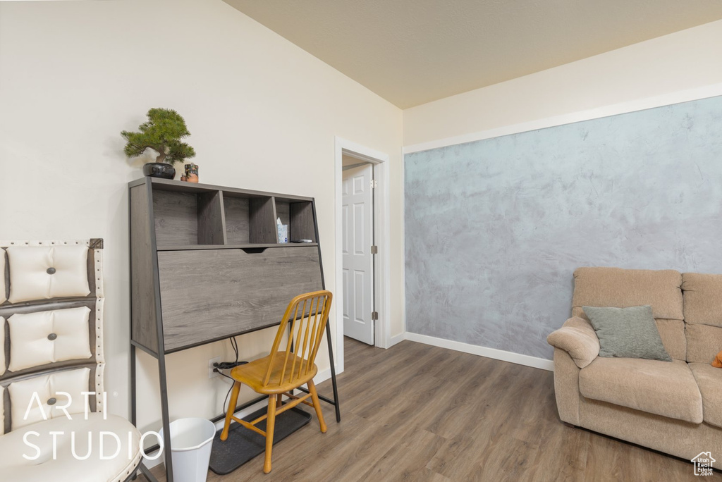 Home office with wood finished floors and baseboards