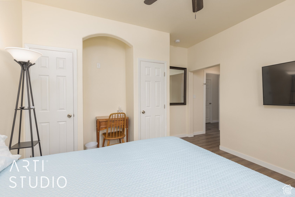 Bedroom with wood finished floors and a ceiling fan