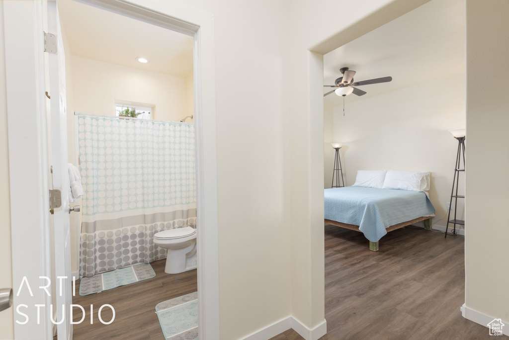 Bedroom featuring wood finished floors and ensuite bathroom