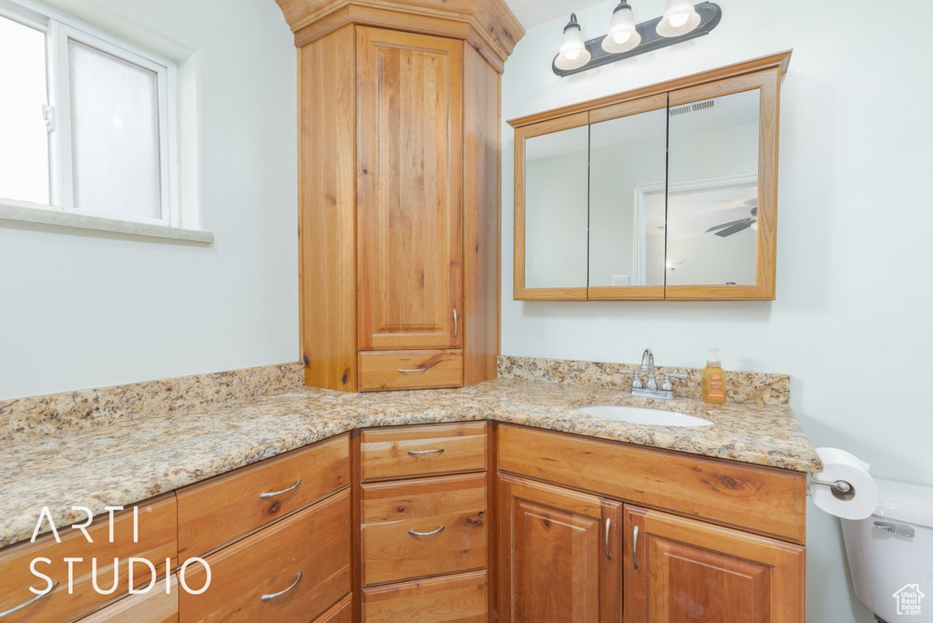 Bathroom with vanity and toilet