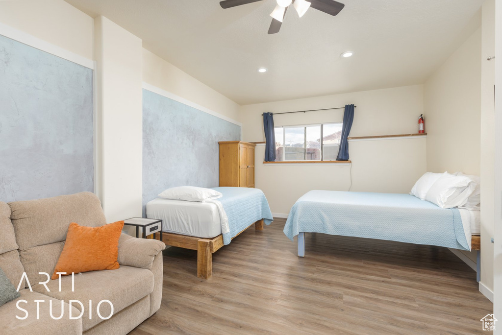 Bedroom featuring light wood-style flooring, recessed lighting, and a ceiling fan