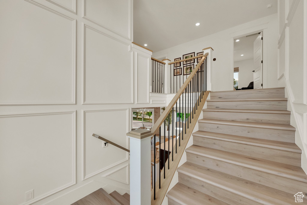 Stairway featuring recessed lighting