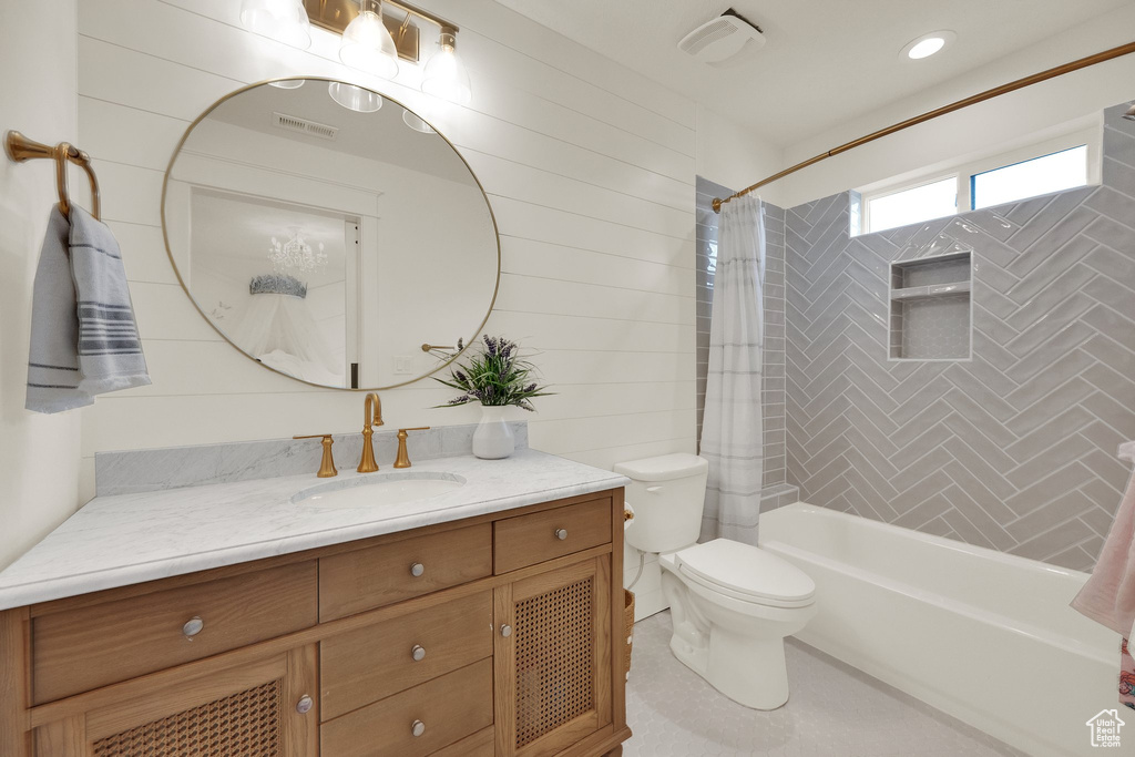 Bathroom with vanity and shower / bath combo with shower curtain