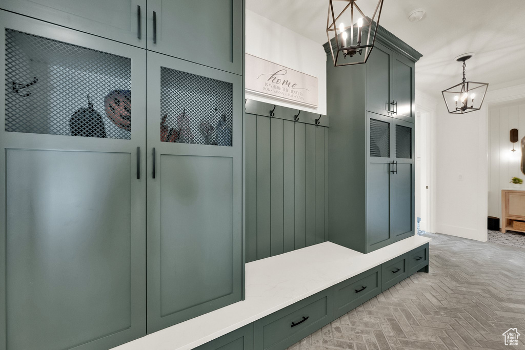 Mudroom with a chandelier