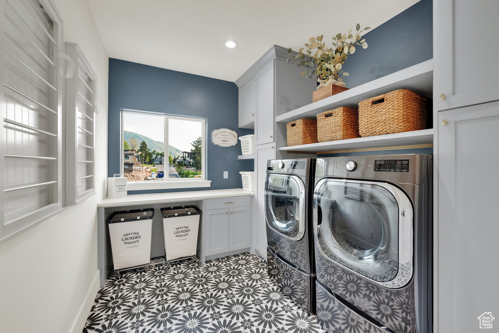 Laundry room with independent washer and dryer, cabinet space, tile patterned floors, and recessed lighting