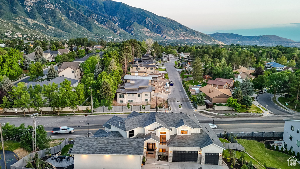 Aerial view of residential area featuring a mountain backdrop