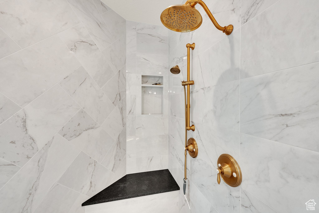 Bathroom with a marble finish shower