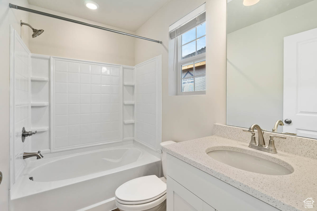Bathroom with vanity and shower / tub combination