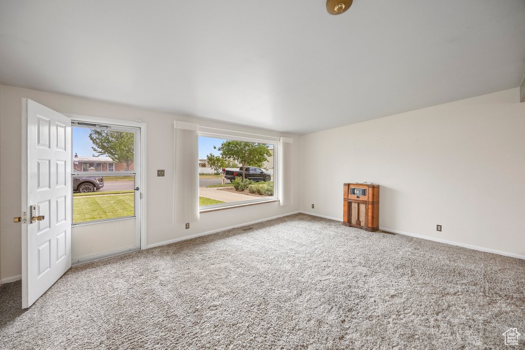 Empty room with carpet floors