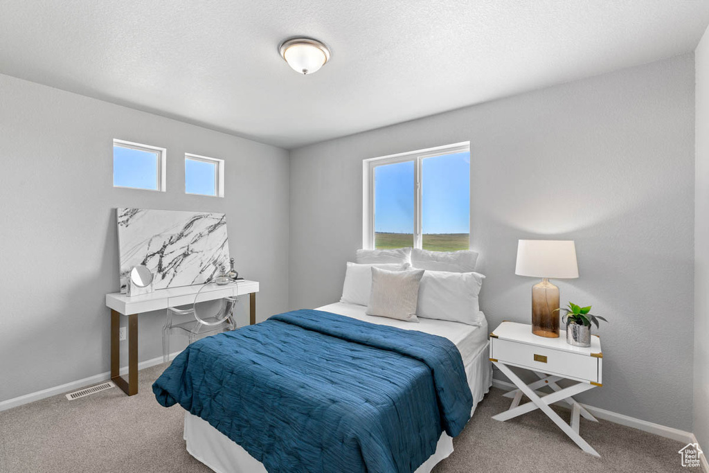 Bedroom featuring carpet floors