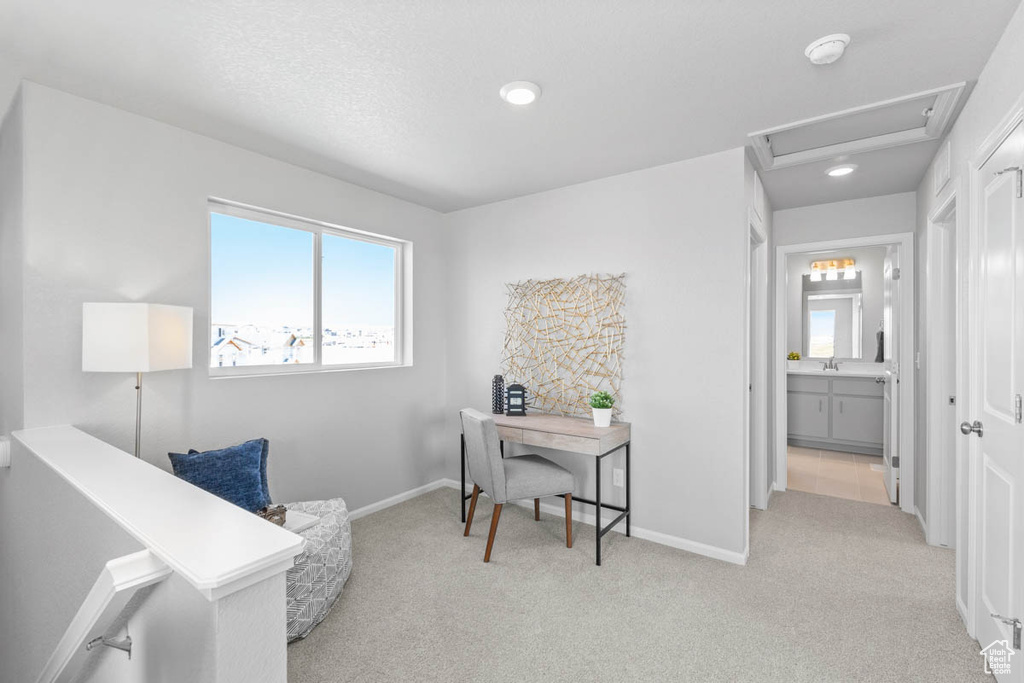 Home office with carpet floors, recessed lighting, and attic access