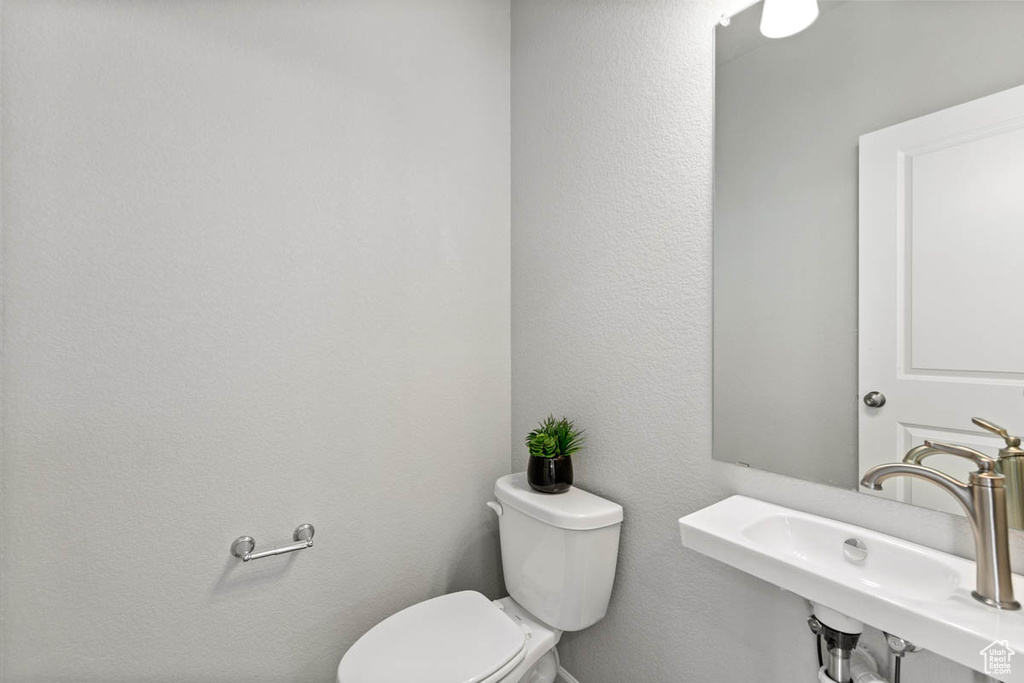 Bathroom featuring toilet and a sink
