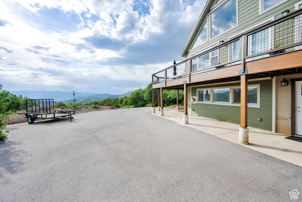 View of patio / terrace featuring a deck with mountain view