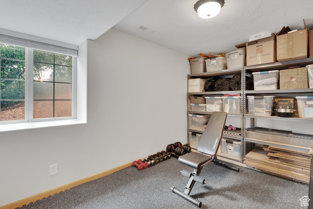 Exercise area with a textured ceiling