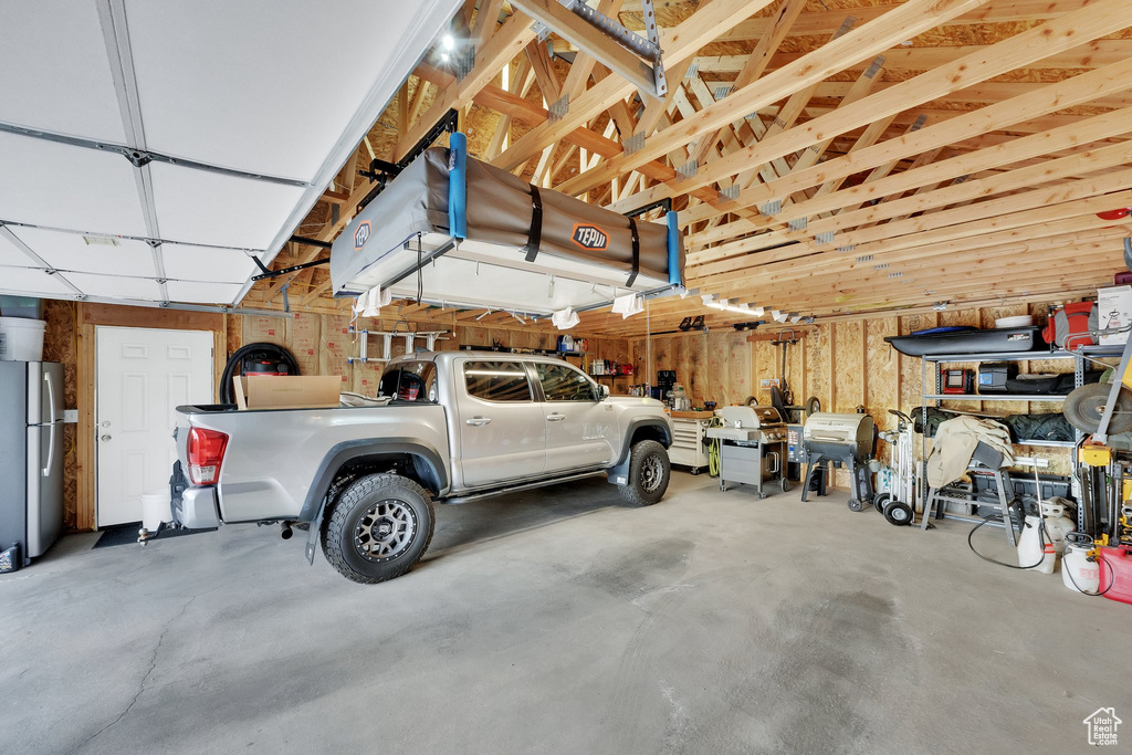 Garage with freestanding refrigerator