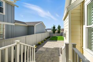 Fenced backyard with a patio