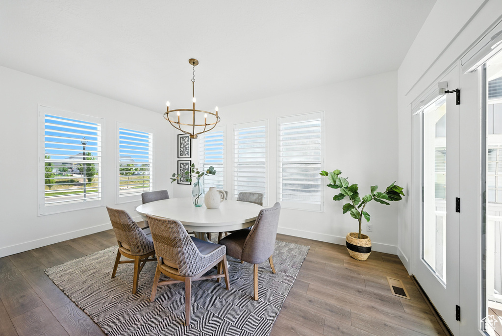 Dining room featuring a chandelier and wood finished floors