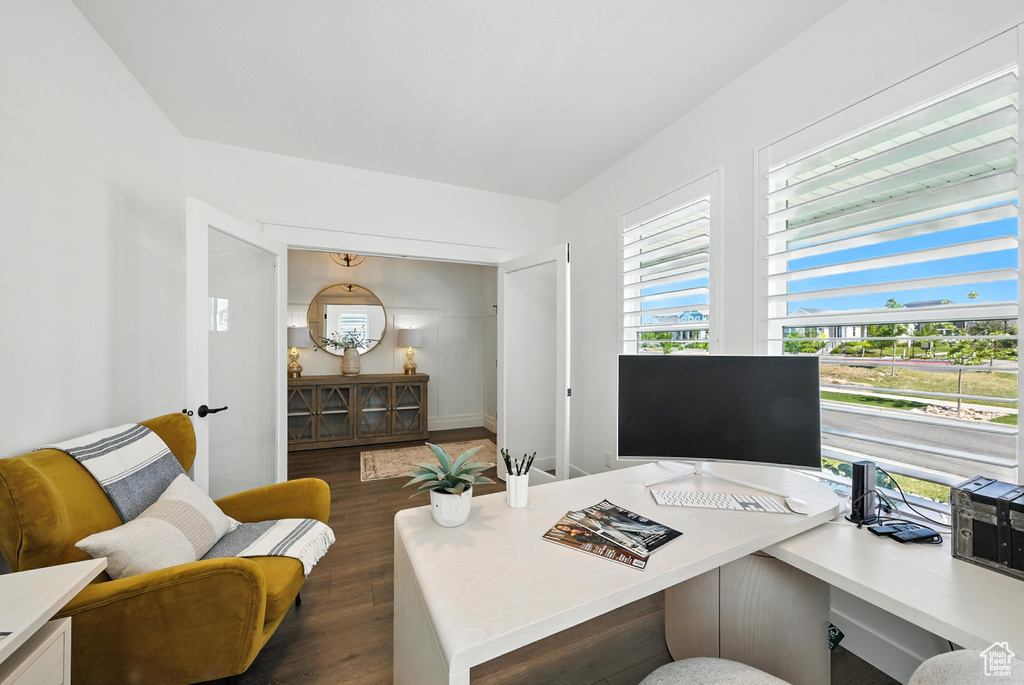 Home office featuring dark wood finished floors