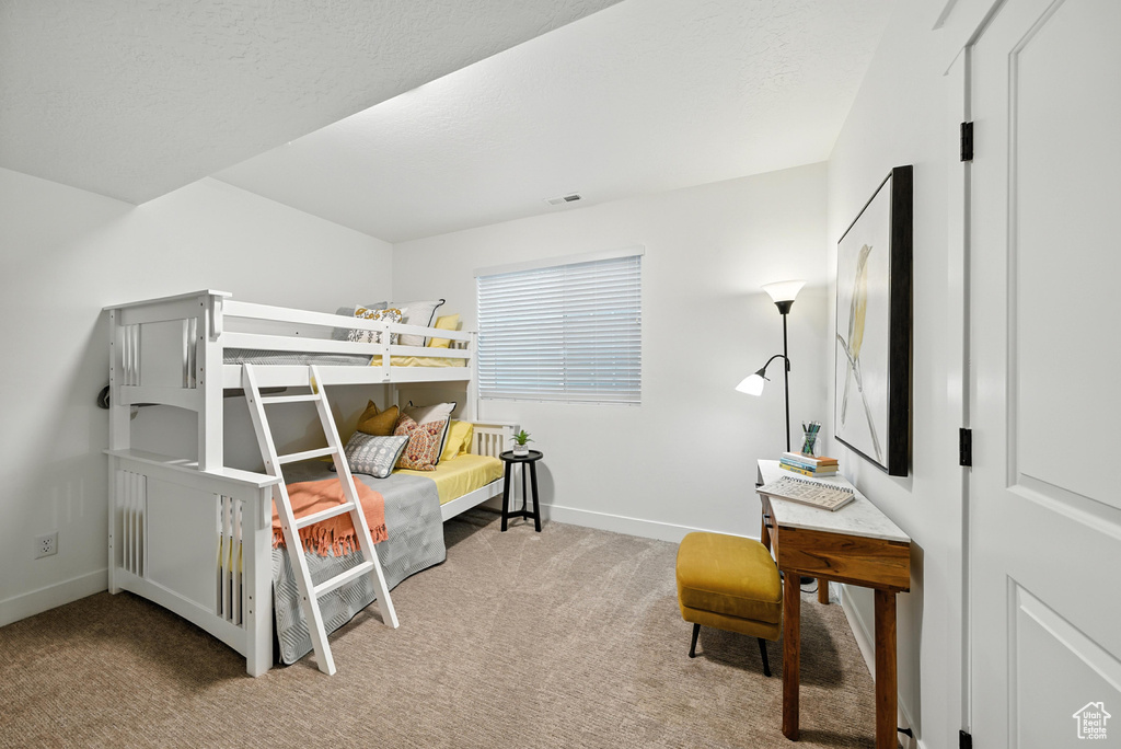 Bedroom featuring carpet