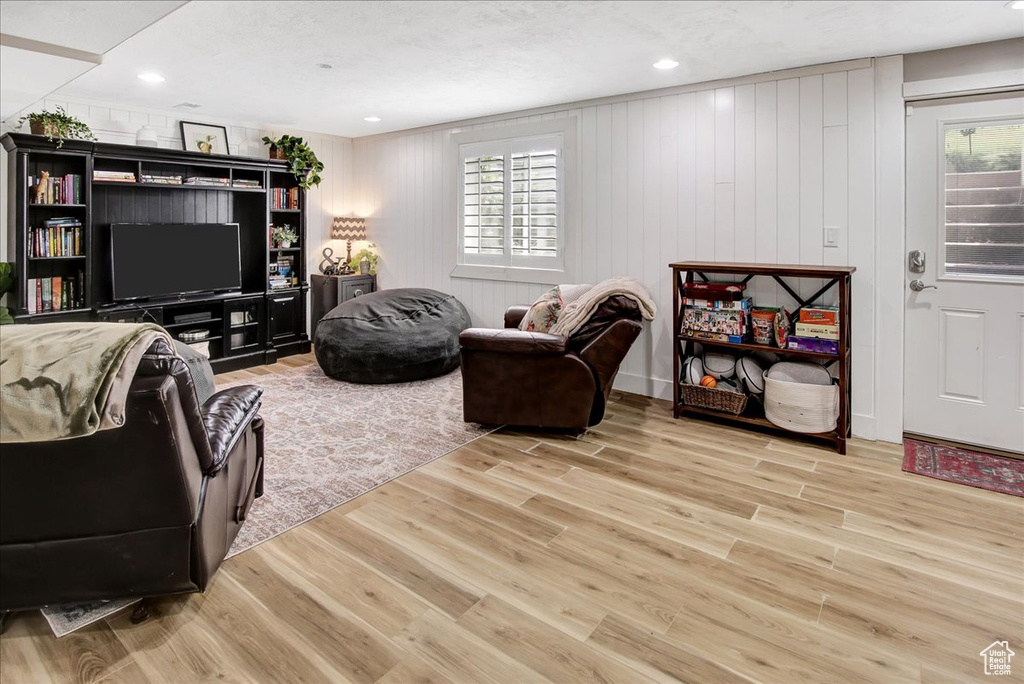 Living area with wood finished floors and plenty of natural light