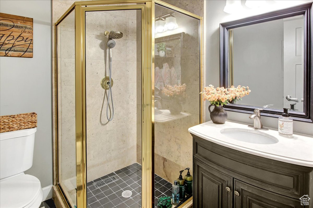 Full bath featuring vanity and a shower stall